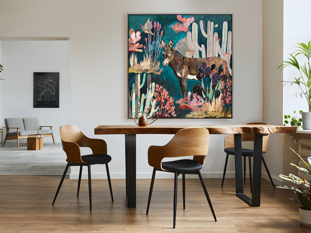 Dolan Geiman contemporary Southwest art shown in dining room. This original paper collage features a Burro, cactus, and quail in turquoise and pink hues.