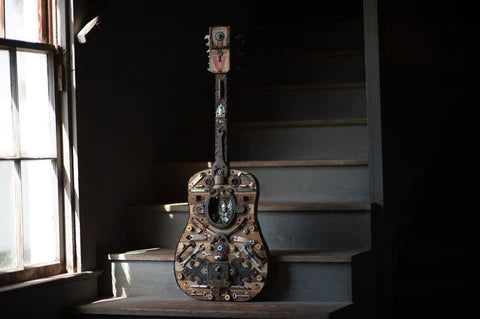 Mixed media found object sculpture acoustic guitar